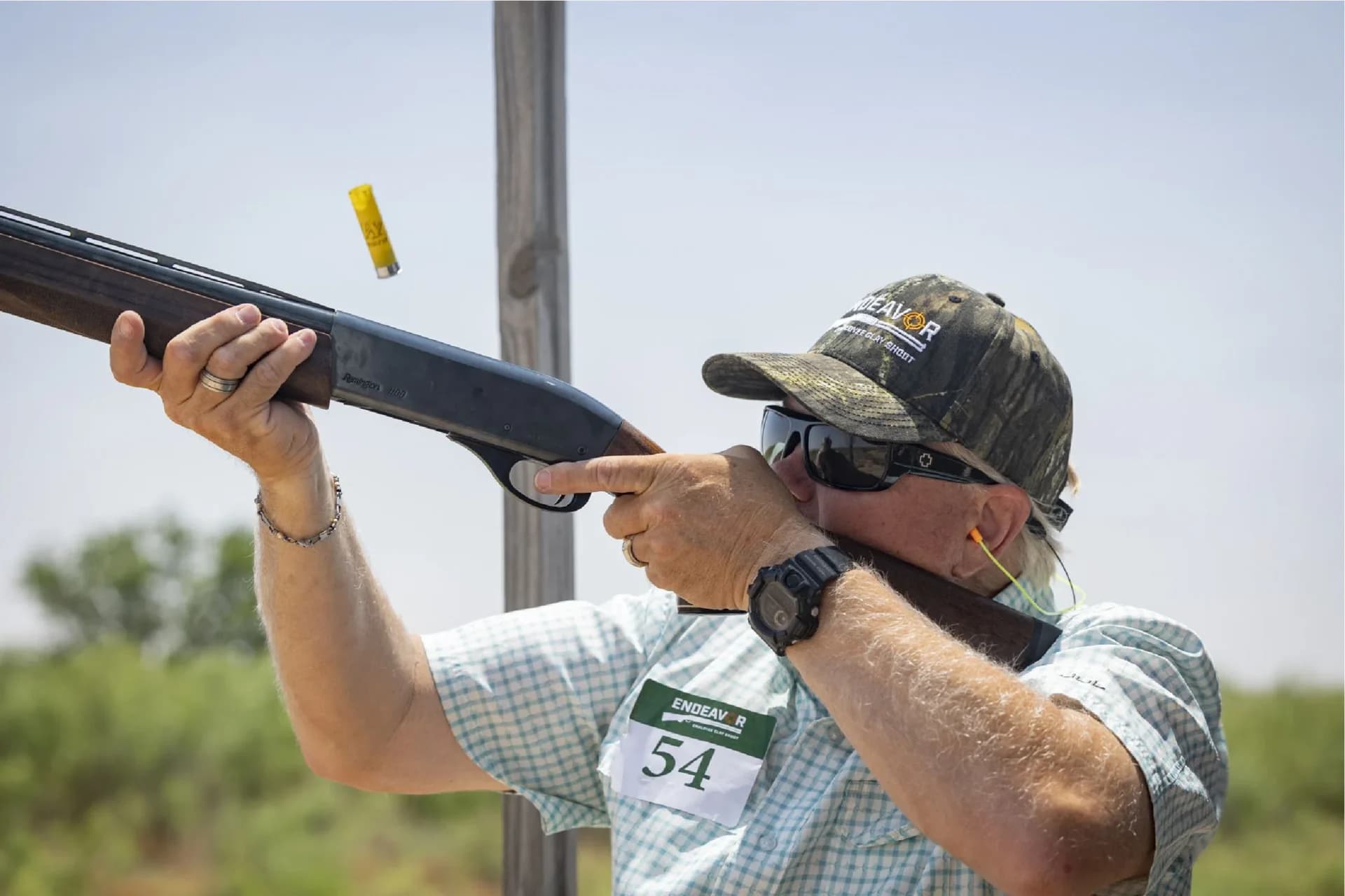 a man aiming a rifle at a target
