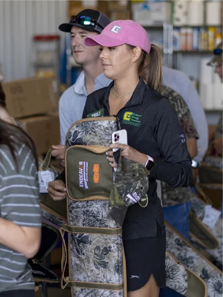a group of people standing in a warehouse