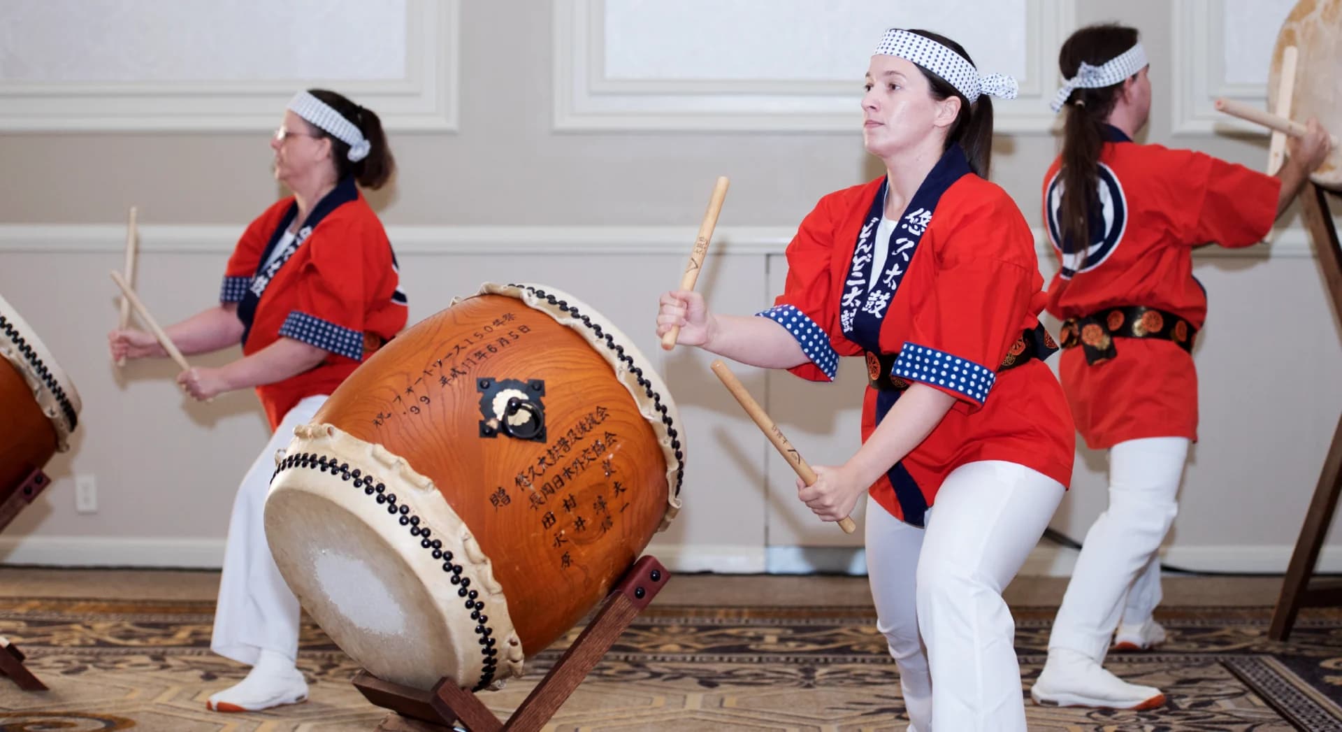 A group of musicians playing drums together