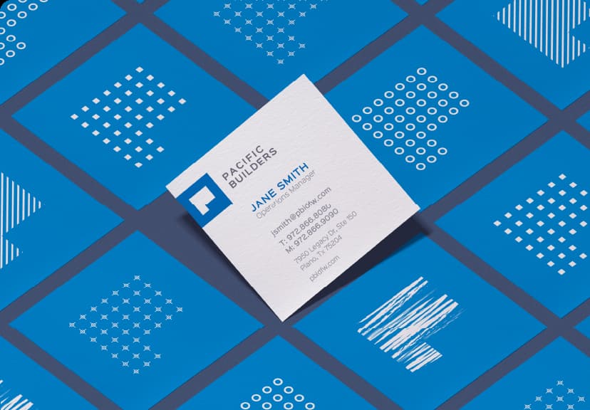 a business card sitting on top of a blue surface