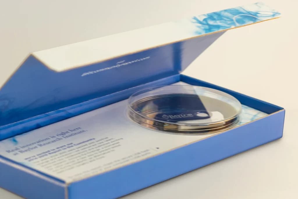 A computer mouse in a blue box on a table