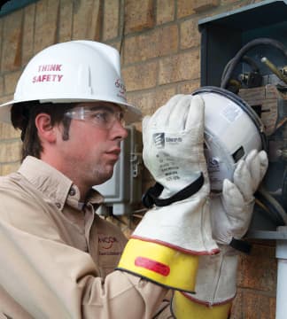 A man wearing a hard hat and safety gear