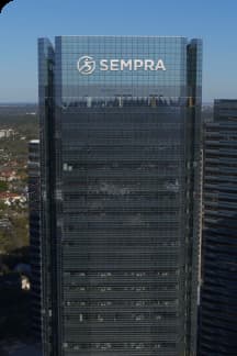 A tall building with a sempra logo on it